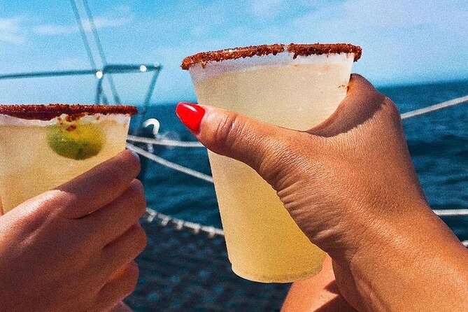 Cabo San Lucas Sunset Cruise with Open Bar and Snacks - On-board vibe: music, crew service, and picture help