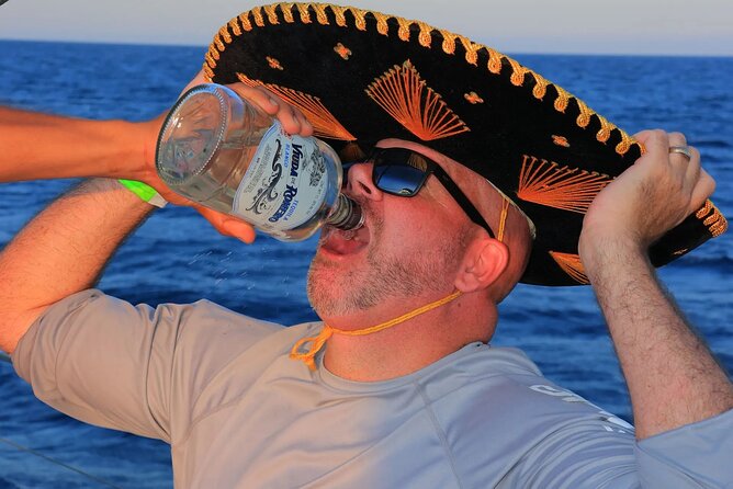 Los Cabos Catamaran Cruise with Open Bar & Light Snack - Onboard vibe: music, crew service, and the social feel
