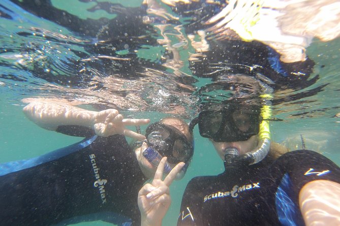 Pelican Rock Snorkeling and Sightseeing Adventure - The bay cruise: Lovers Beach, Neptune finger, window to the Pacific, Arch