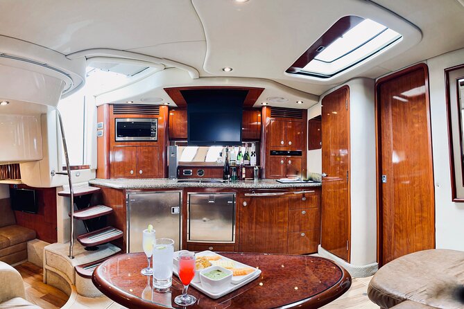 Private Yacht Sea Ray all-inclusive charter in Cabo - Stop 2: Médano Beach Open Bar Break (The Snack-and-Swim Phase)